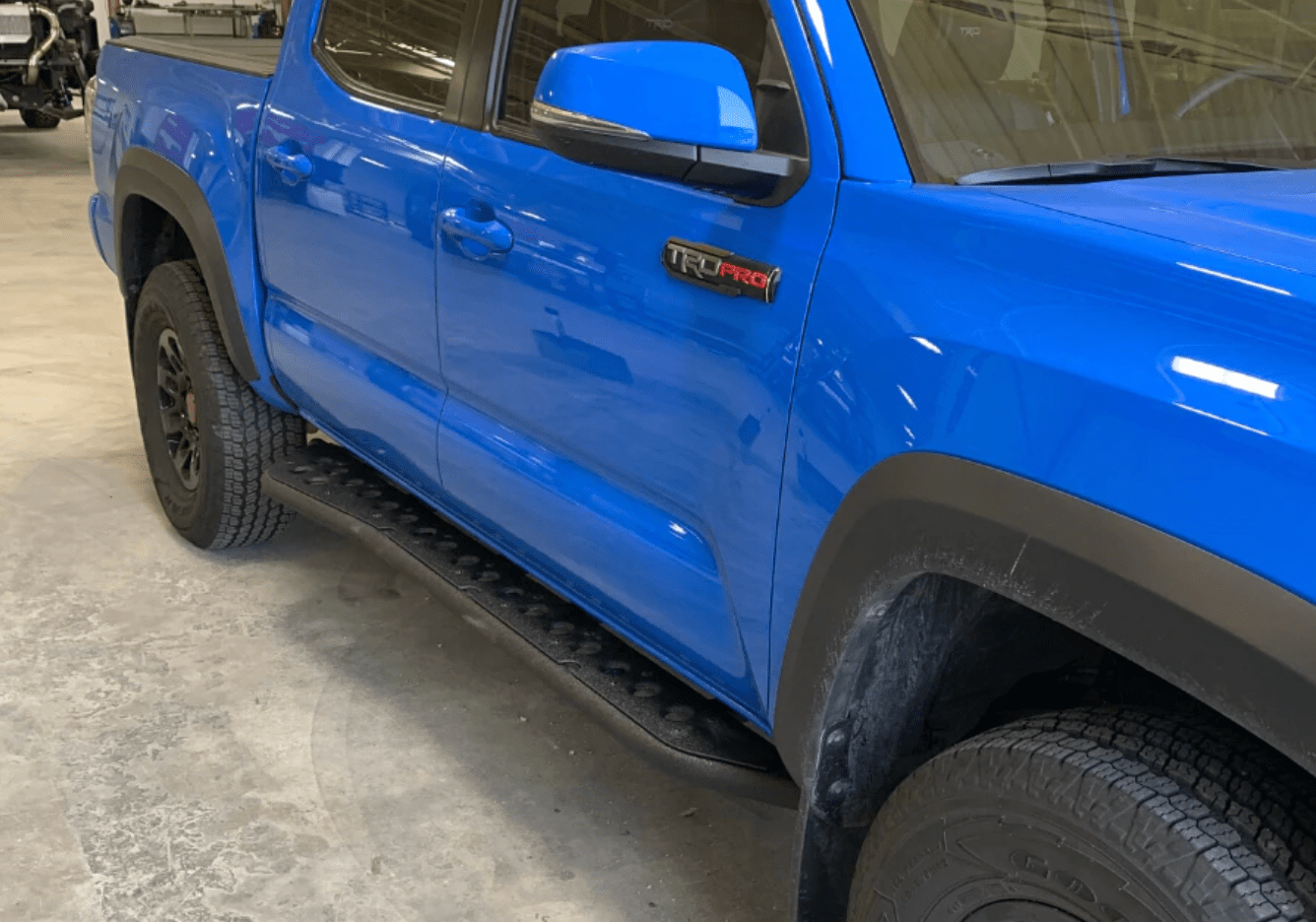 Cali Raised LED Armor 2005-2022 TOYOTA TACOMA STEP EDITION ROCK SLIDERS