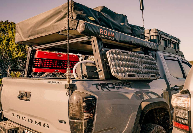 Load image into Gallery viewer, overland bed rack on a toyota tacoma
