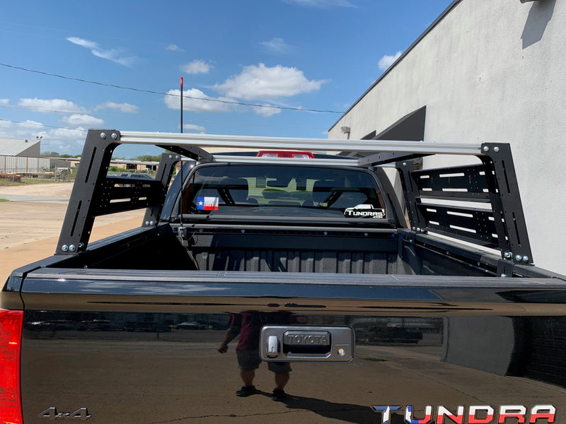 Load image into Gallery viewer, Close-up rear view of black Toyota Tundra with Overland Bed Rack - Cali Raised LED
