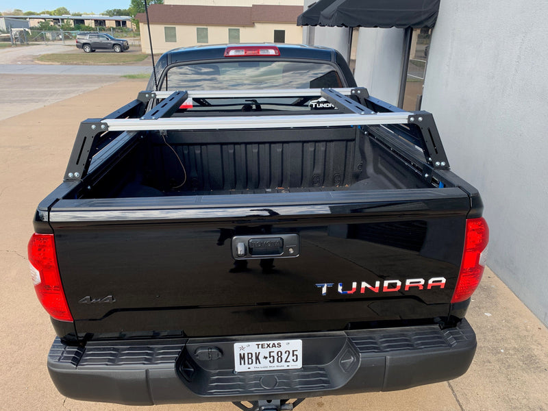Load image into Gallery viewer, Rear view of black Toyota Tundra with Overland Bed Rack - Cali Raised LED
