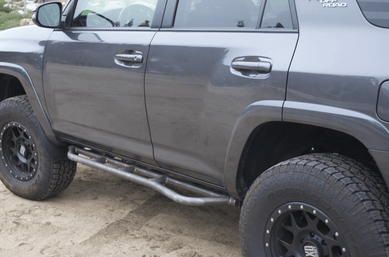 Load image into Gallery viewer, 2010-2022 TOYOTA 4RUNNER STEP EDITION BOLT ON ROCK SLIDERS
