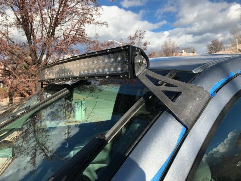 Load image into Gallery viewer, Curved LED light bar and roof mounting brackets on gray Toyota Tundra - Cali Raised LED

